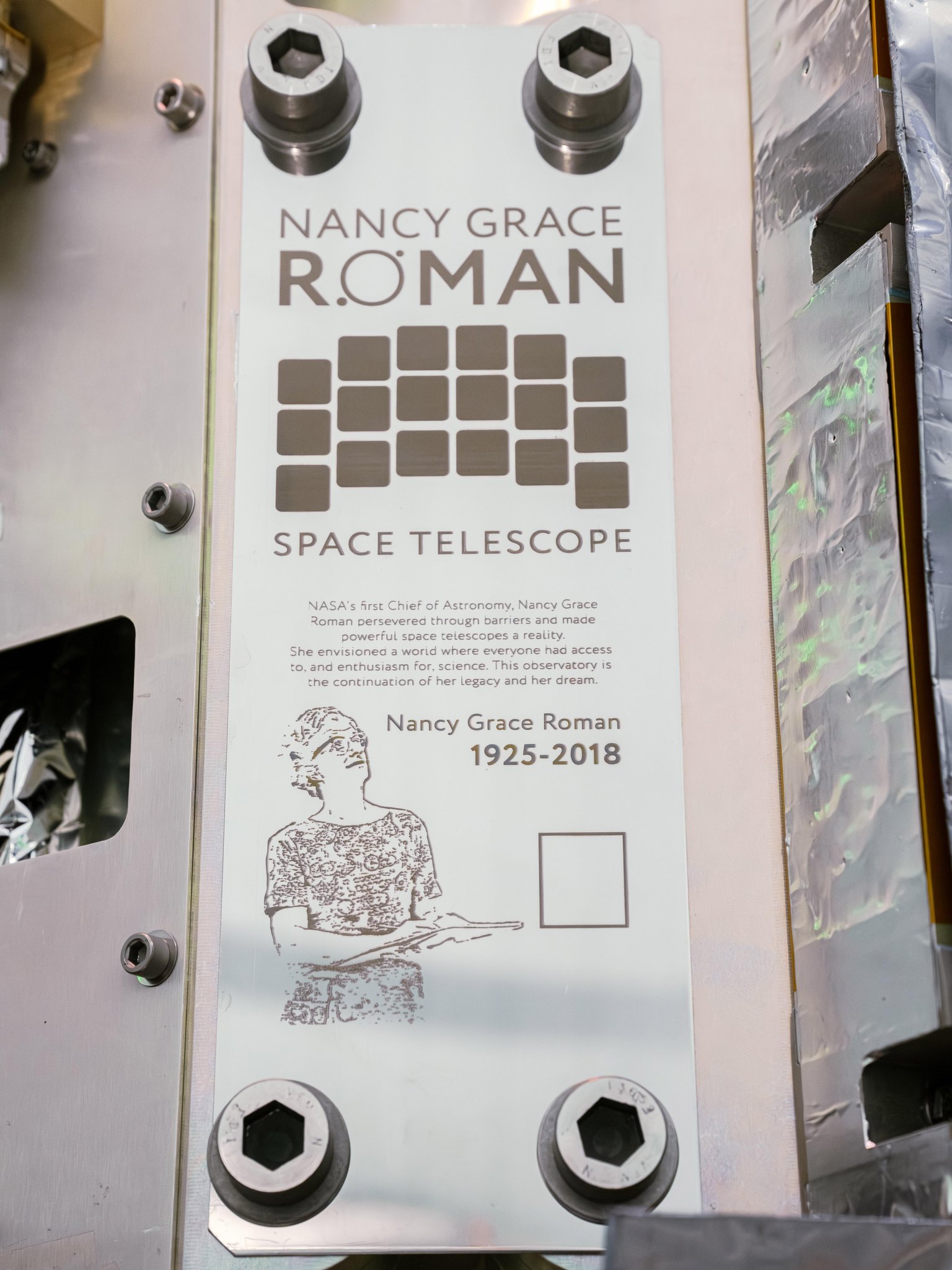 Commemorative plaque on the Nancy Grace Roman Space Telescope, with the small square mount for a memory card containing more than 1.3 million submitted names